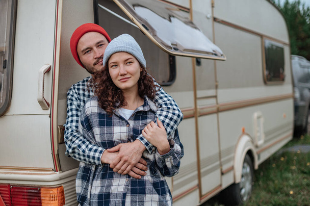 Romantic couple spending time together near trailer home. - Photo, Image