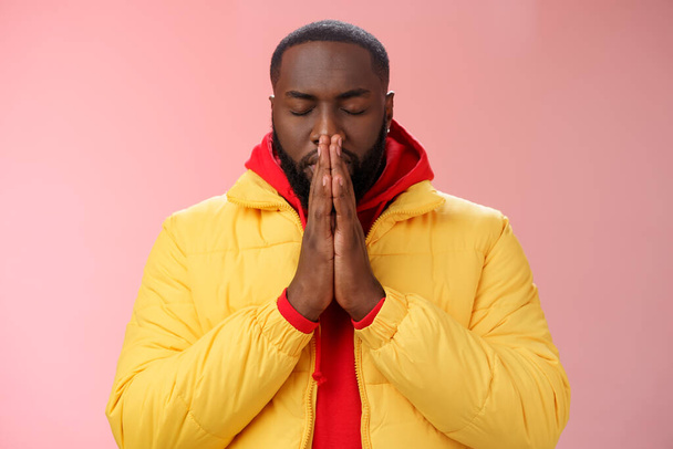 Serious-looking determined young focused african-american man prepare will important meeting press palms together hands pray close eyes supplicating praying make wish, standing pink background - Photo, Image