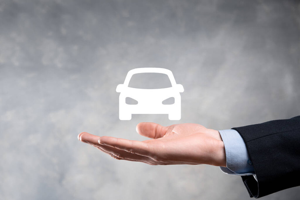 Digital composite of Man holding car icon.Car automobile insurance and car services concept. Businessman with offering gesture and icon of car. - Photo, Image