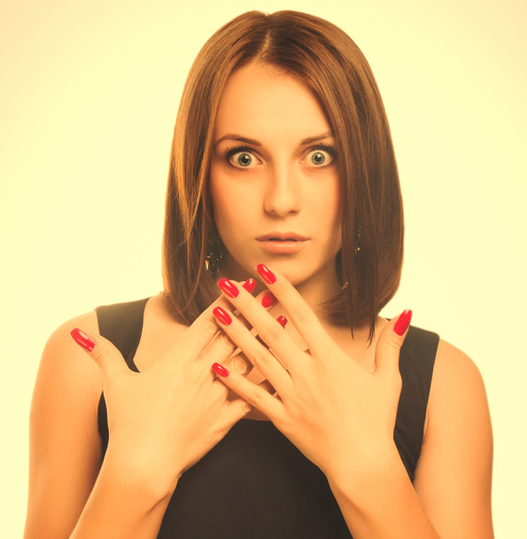 Surprised excited beautiful brunette woman throws up his hands o - Photo, Image