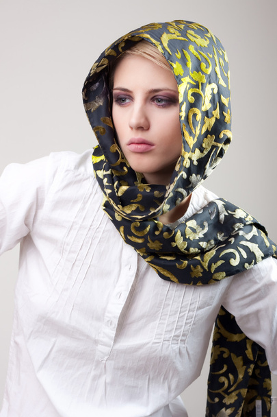 Attractive blond girl in scarf and white shirt - Фото, изображение