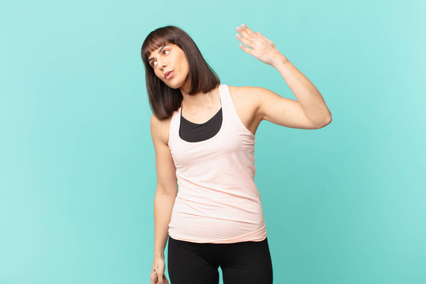 athlete woman feeling stressed, anxious, tired and frustrated, pulling shirt neck, looking frustrated with problem - Photo, image