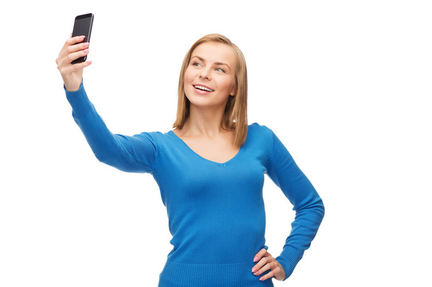 Woman taking self picture with smartphone camera - Φωτογραφία, εικόνα