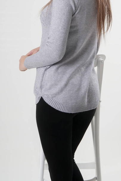 Girl in black leggings and light gray blouse - Photo, Image