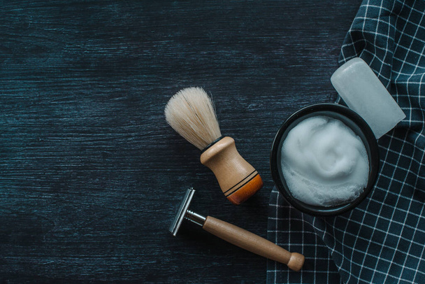 Barber tools on a black background. Shaving foam with razor, shaving brush and White crystal alum stone or Potassium alum, Horizontal banner with place for text - Photo, Image