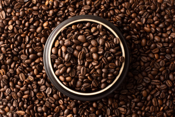 Coffee beans. Coffee beans are spread out on the surface. - Photo, image