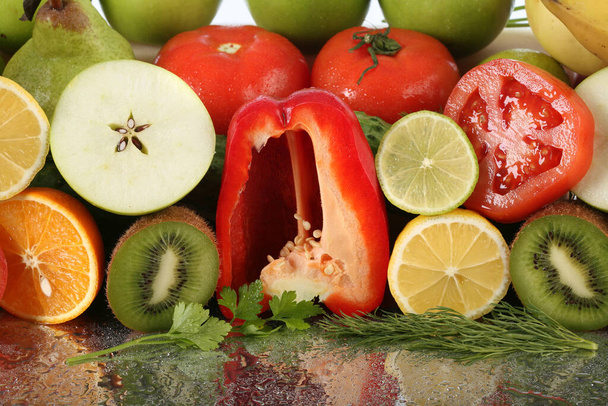close-up of assorted cut ripe fruits and vegetables studio - Φωτογραφία, εικόνα