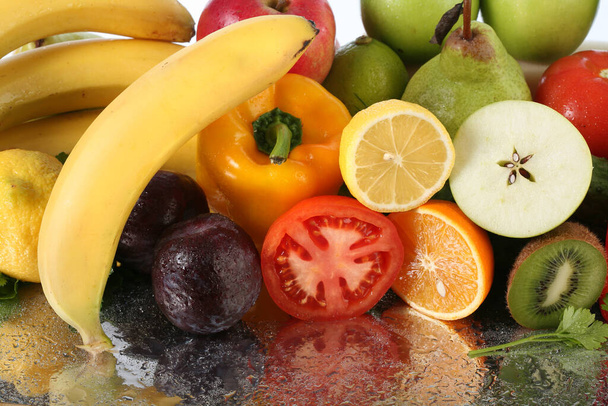 close-up of assorted cut ripe fruits and vegetables studio - Valokuva, kuva