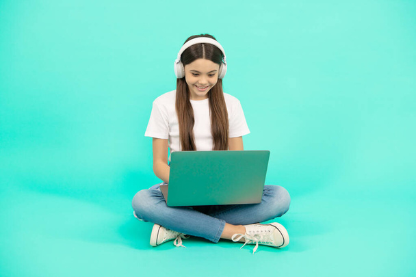 communication technology. video call. child chatting on computer. buy online. back to school. teen influencer blogging. happy girl in headphones. music. webinar in wireless headset. modern education. - Photo, Image