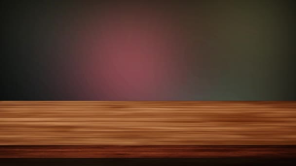 Tavolo vuoto in legno davanti a tremolio di sfondo giallo-verdastro e marrone-nerastro. Effetto luce e perdite. Video HD - Filmati, video