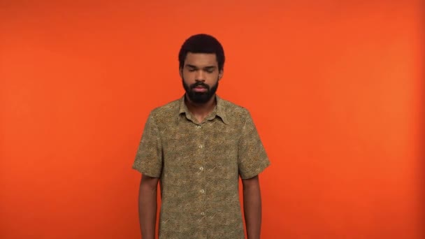 african american man saying no isolated on orange - Кадри, відео