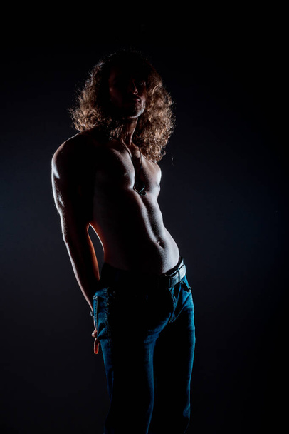 Studio body shot of a fashion male model wearing stylish clothes - Foto, imagen