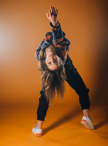 Modern dance performer practicing dance moves at the studio - Photo, Image