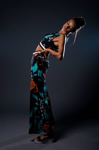 Studio body shot of a fashion female model posing in modern clothing - Foto, Imagem