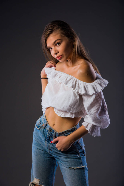 Portrait of an attractive young woman dressed in stylish clothing - Photo, Image