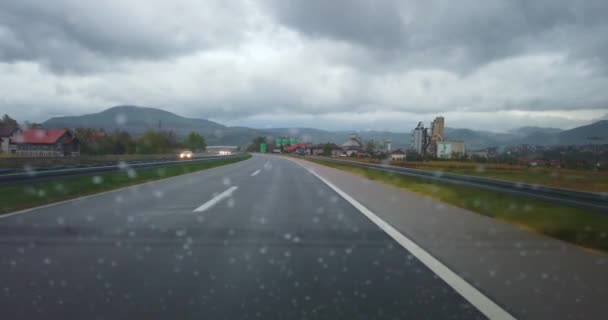view of the rain highway from the windshield of the car - Footage, Video