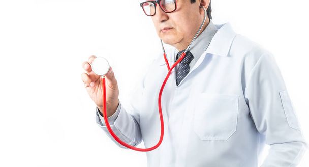 Latino doctor in white coat and glasses holding a stethoscope in position to check the heart and lungs of a patient. Hospital, medicine and medical diagnosis concept - Φωτογραφία, εικόνα