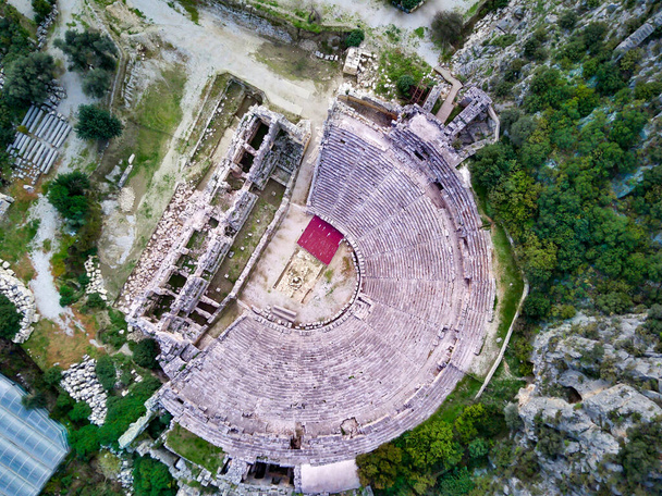 High angle drone aerial view of ancient greek rock cut lykian empire amphitheatre and tombs in Myra (Demre, Turkey) - Photo, Image