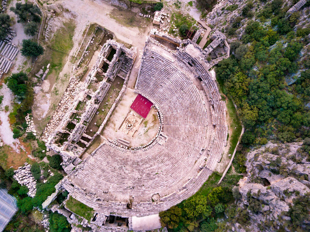 High angle drone aerial view of ancient greek rock cut lykian empire amphitheatre and tombs in Myra (Demre, Turkey) - Photo, Image
