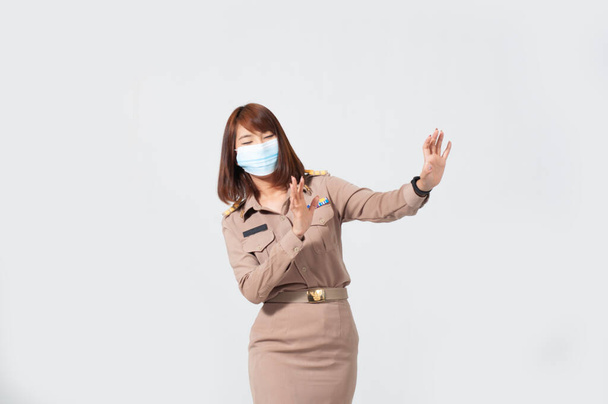 Female thai teacher in uniform standing with white background  - Photo, Image