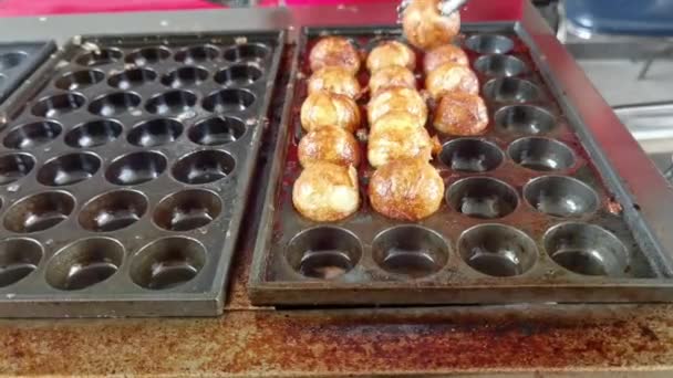 Japanese confectionery background in a hole tray on the stove - Video