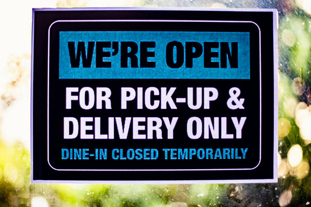TAKE OUT ONLY! Please respect social distancing while ordering sign in a window during COVID-19. - Photo, Image