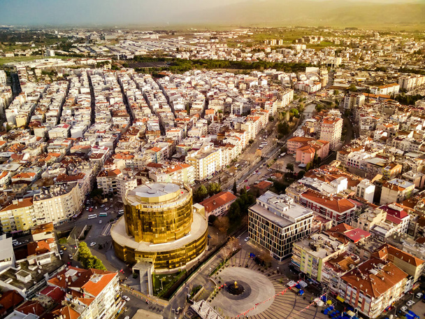 Aerial photograph of the capital of Aydin province - Aydin city from high point of drone fly in sunny day in Turkey. Amazing aerial cityscape view from birds fly altitude on beautiful city centre and parks. - Photo, Image