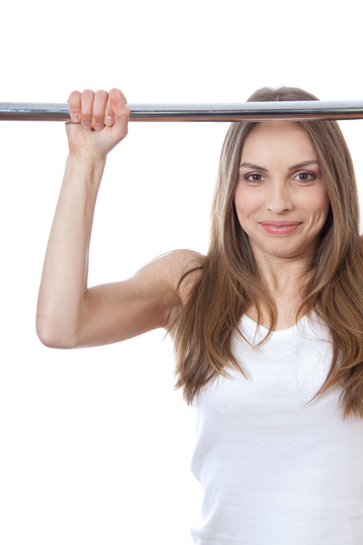 Woman exercising on pull-up bar - Foto, immagini