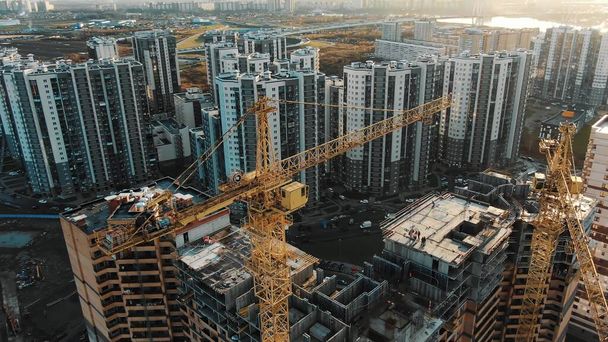 round aerial view high cranes build new dwelling complex - Photo, Image