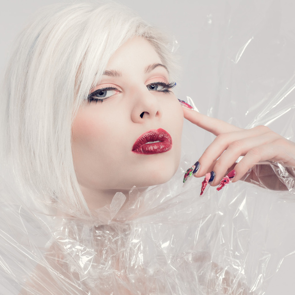 Posing blonde fashion model in plastic - Foto, Imagem