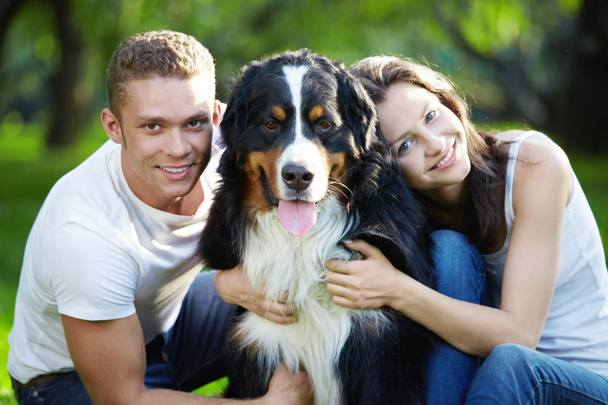 Young couple with a dog - Photo, Image
