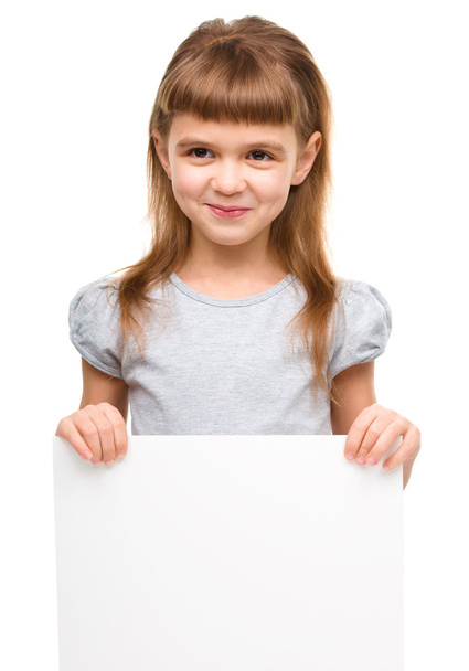 Little girl is holding blank banner - Foto, afbeelding