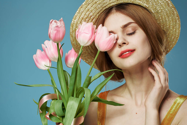 Beautiful woman elegant style hat close-up bouquet of flowers - Photo, Image