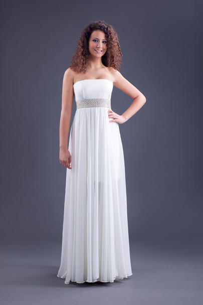 Young beautiful curly female model in white dress - Zdjęcie, obraz