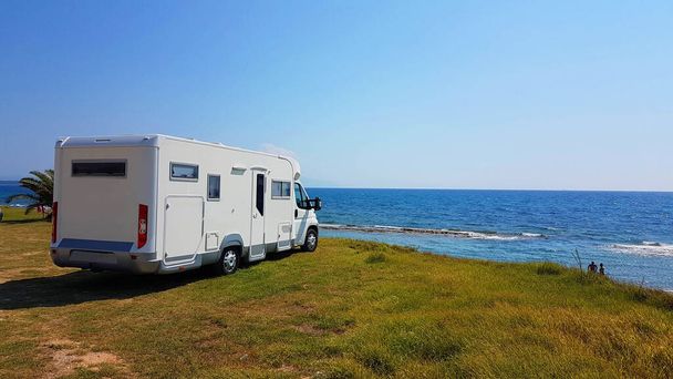 caravan trailer car by the sea in summer holidays sunny hot day - Photo, Image
