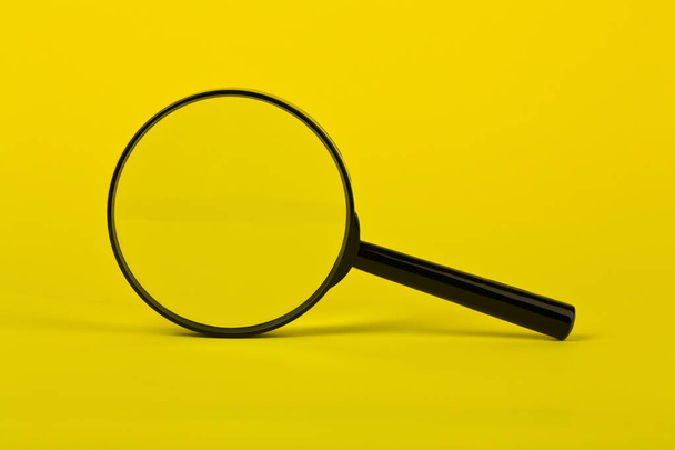 Magnifying glass on a yellow background close-up.Detail for design. Design elements. Macro. Minimal idea creative concept  - Zdjęcie, obraz
