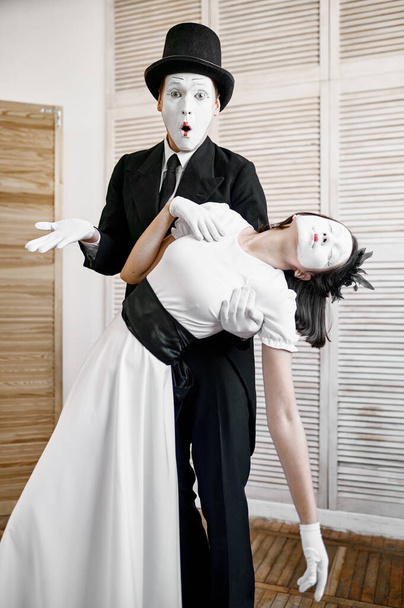 Two mime artists, parody, comedy performance. Pantomime theater, comedian, positive emotion, humour performance, funny face mimic and grimace - Photo, Image