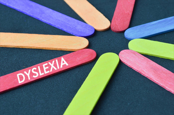 Ice cream stick written with text DYSLEXIA - Photo, Image