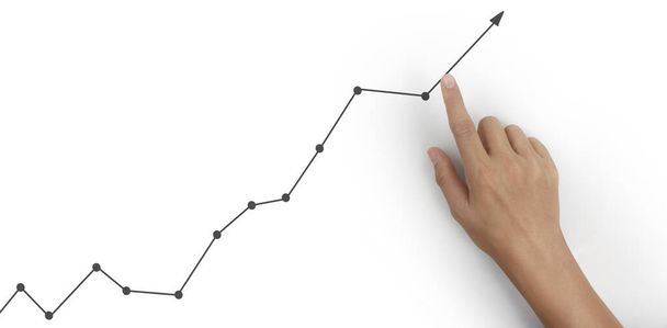 Berühren einer Grafik des Finanzindikators und des marktwirtschaftlichen Analysediagramms mit der Hand - Foto, Bild