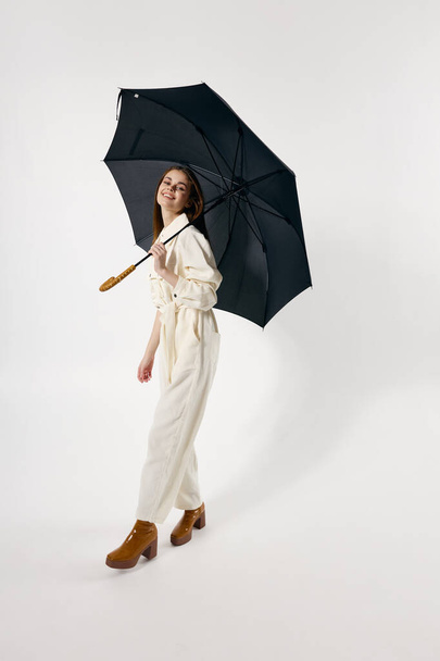 attractive woman white overalls brown boots autumn style umbrella - Foto, Bild