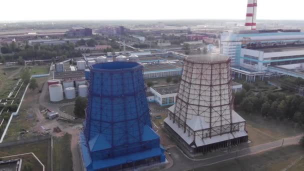 Quadrocopter shooting of a thermal power plant with large cooling towers against the background of transformers and power lines - Footage, Video