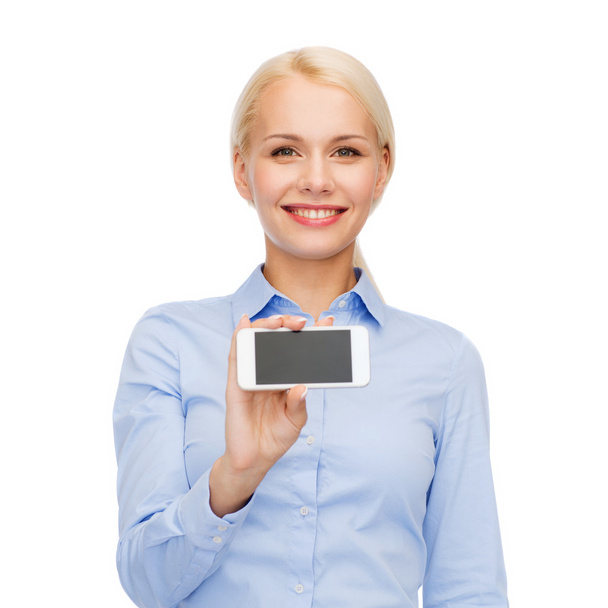 Smiling businesswoman with smartphone blank screen - Foto, imagen