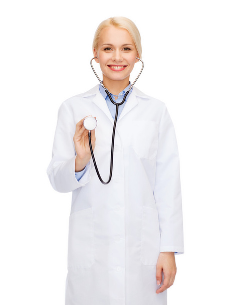 Smiling female doctor with stethoscope - 写真・画像