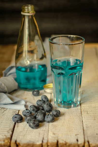  blue color lemonade with blueberry. Close up - drink berry taste - Photo, Image