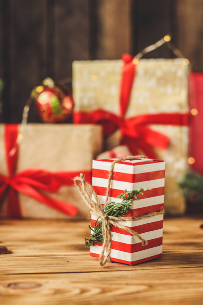 christmas gift boxes on wooden background - 写真・画像