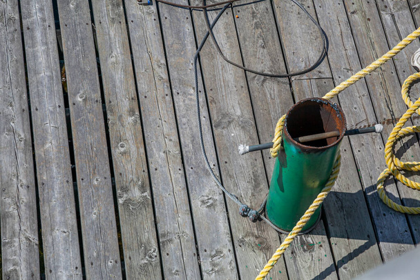 Metal cleat with yellow rope for docking  - Photo, Image
