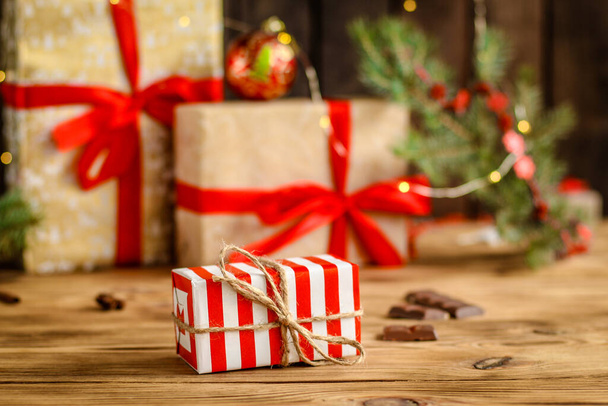 christmas gift boxes on wooden background - 写真・画像