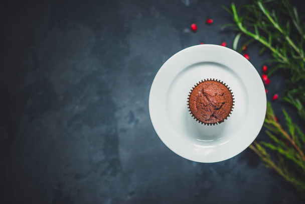 chocolate muffin with pomegranate seeds - Photo, Image