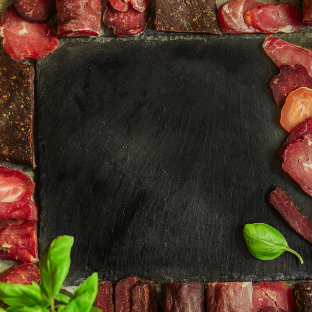 salami meat plate, sliced (sausages) . food background.  Top view with copy space - Zdjęcie, obraz