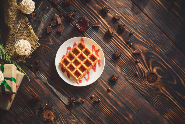 close-up view of delicious christmas waffles on wooden table - Photo, image